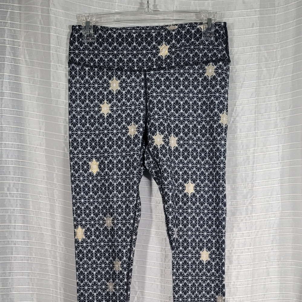Fabletics Women's Size Small Salar Leggings Black and Gold Star Burst